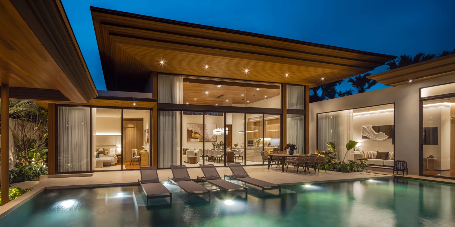 Pool and terrace of the 3-bedroom show villa at night